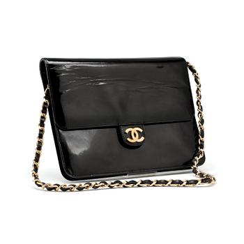 598. CHANEL, a black patent leather flap bag.