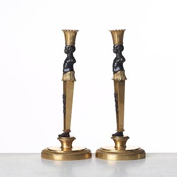 A pair of Empire style candlesticks. Late 19th century.