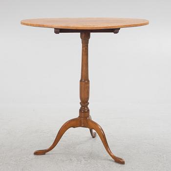 A 19th Century birch tilt top table.