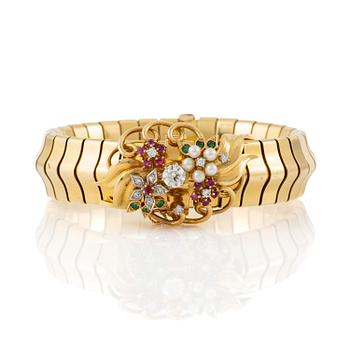 488. A Strömdahls bracelet/pendant combination in 18K gold with rubies, emeralds, pearls and diamonds.