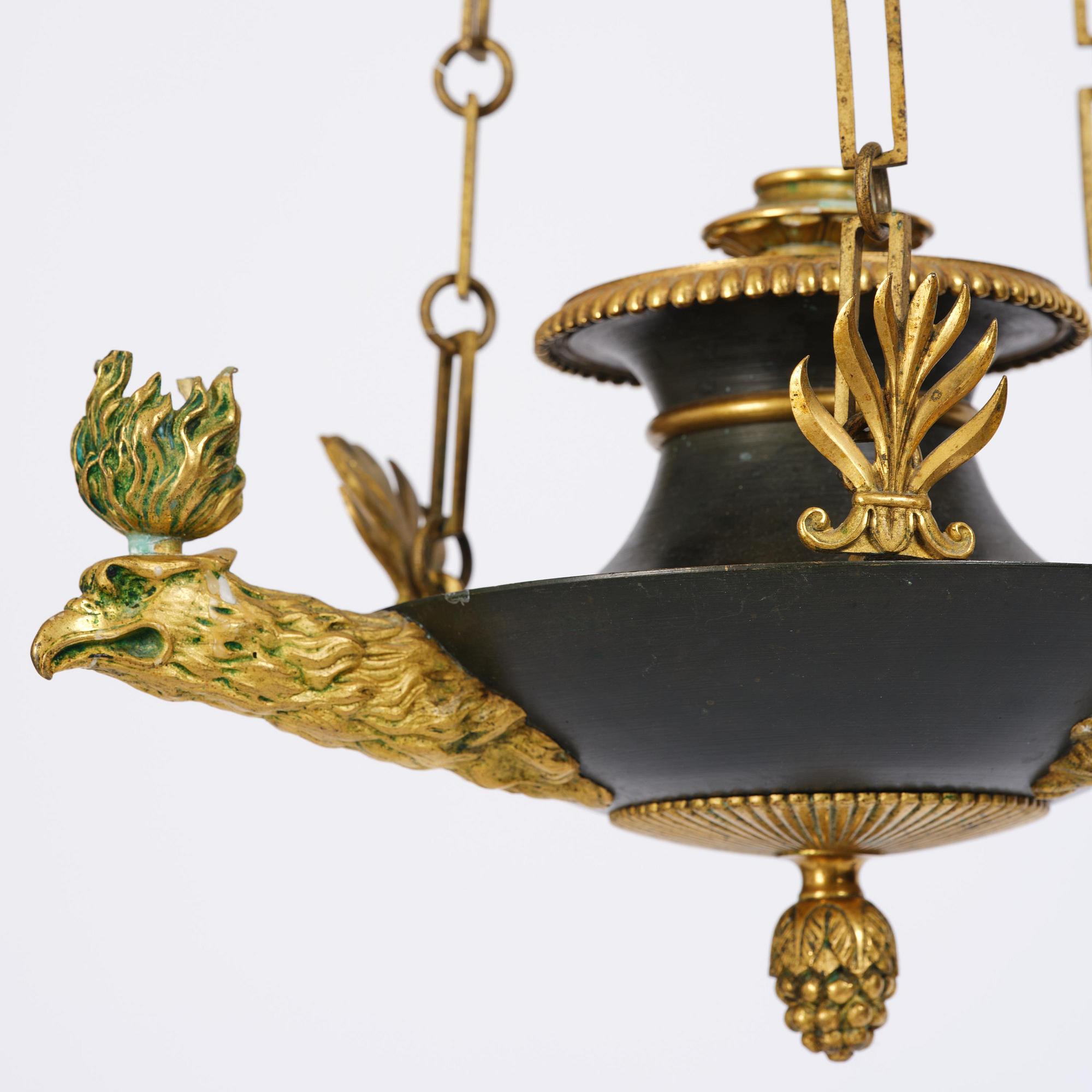 An Empire ormolu and patinated bronze four-light chandelier, Stockholm, early 19th century.