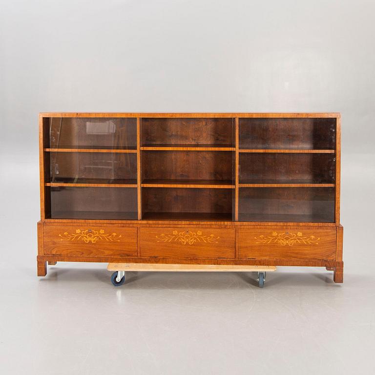 A Swedish Modern 1940s mahogany book cupboard.