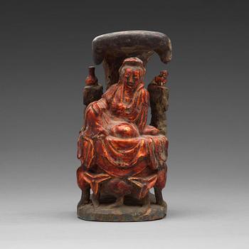 11. A lacquered wooden figure of Guanyin, Ming dynasty (1368-1644).