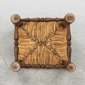 Charles Dudouyt, attributed to, a fireside low chair, mid 20th century.