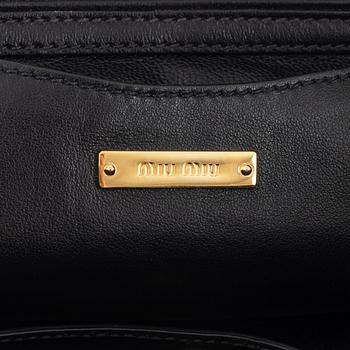 Miu Miu, a black leather handbag.
