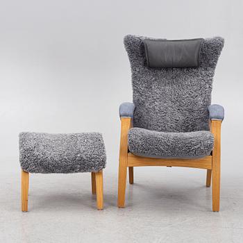 A 'Delta Adventure' armchair with ottoman, Brunstad, Norway.