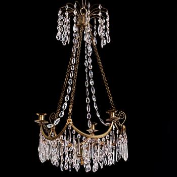 A Gustavian gilt brass and cut glass four-light chandelier, Stockholm, late 18th century.