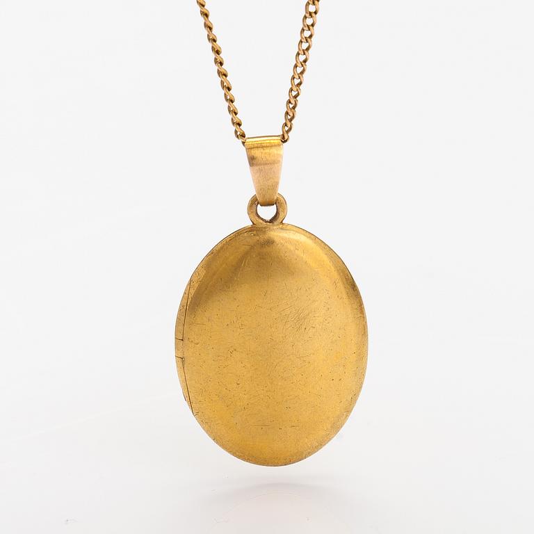 A 14K gold necklace with a medallion.