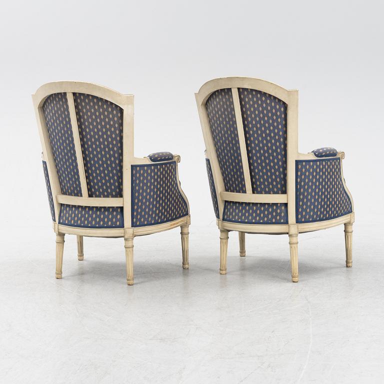 A pair of painted Louis XVI style armchairs, second half of the 20th Century.
