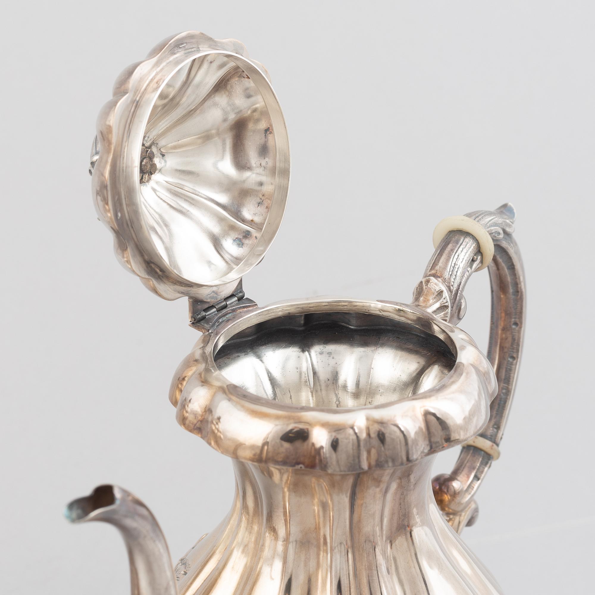 An Austrian silver coffee pot, tea pot, cream jug and sugar bowl, Vienna 1826.