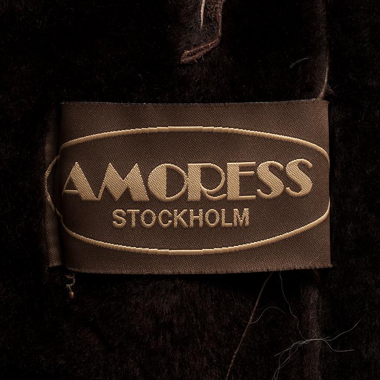 A fur and leather jacket by Amoress, in size app 36.