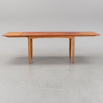 A 1950/60's dining table from Slagelse Møbelvaerk A/S with two additional leaves.