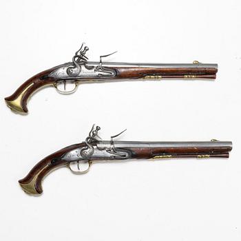 A pair of flintlock pistols signed C SCHEL 1709, Nortelie, (Caspar or Christopher Schiel).