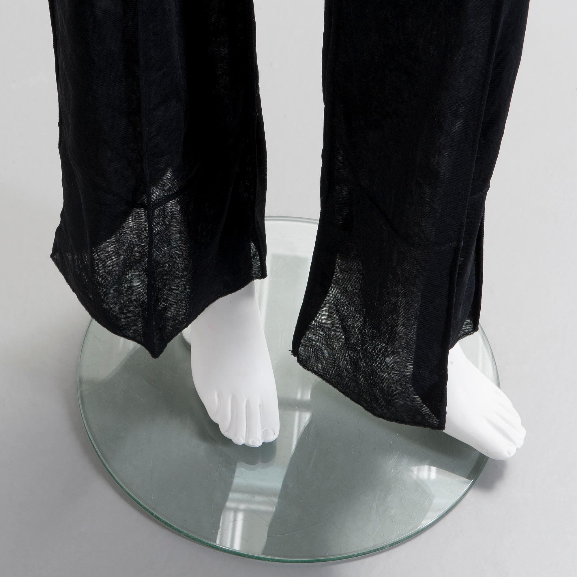 CHANEL, a black mesh evening pant.