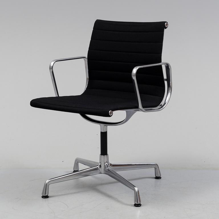 A 'EA 104 Swivel' armchair by Charles & Ray Eames, Vitra, 2016.