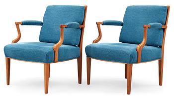 A pair of Josef Frank mahogany, ratten and blue fabric armchairs, Svenskt Tenn, model 969.