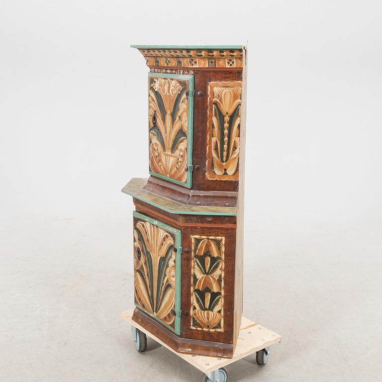 A Swedish painted corner cabinet dated 179?.
