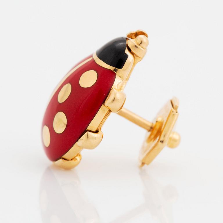 An 18K gold and enamel lady bug Cartier brooch.