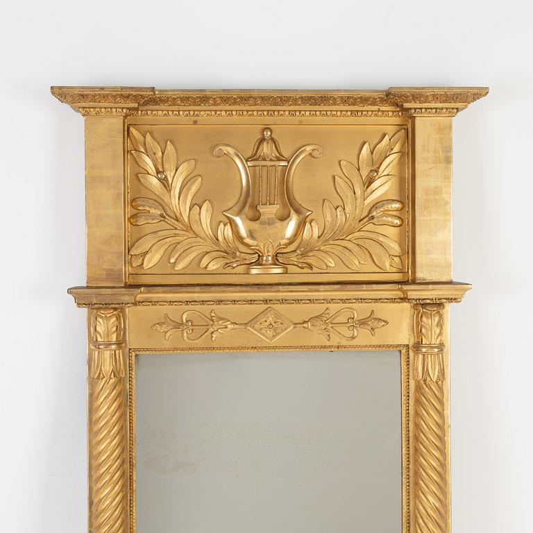 An Empire mirror, first half of the 19th Century.