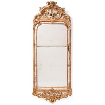 79. A Swedish Rococo mirror, second part of the 18th century.