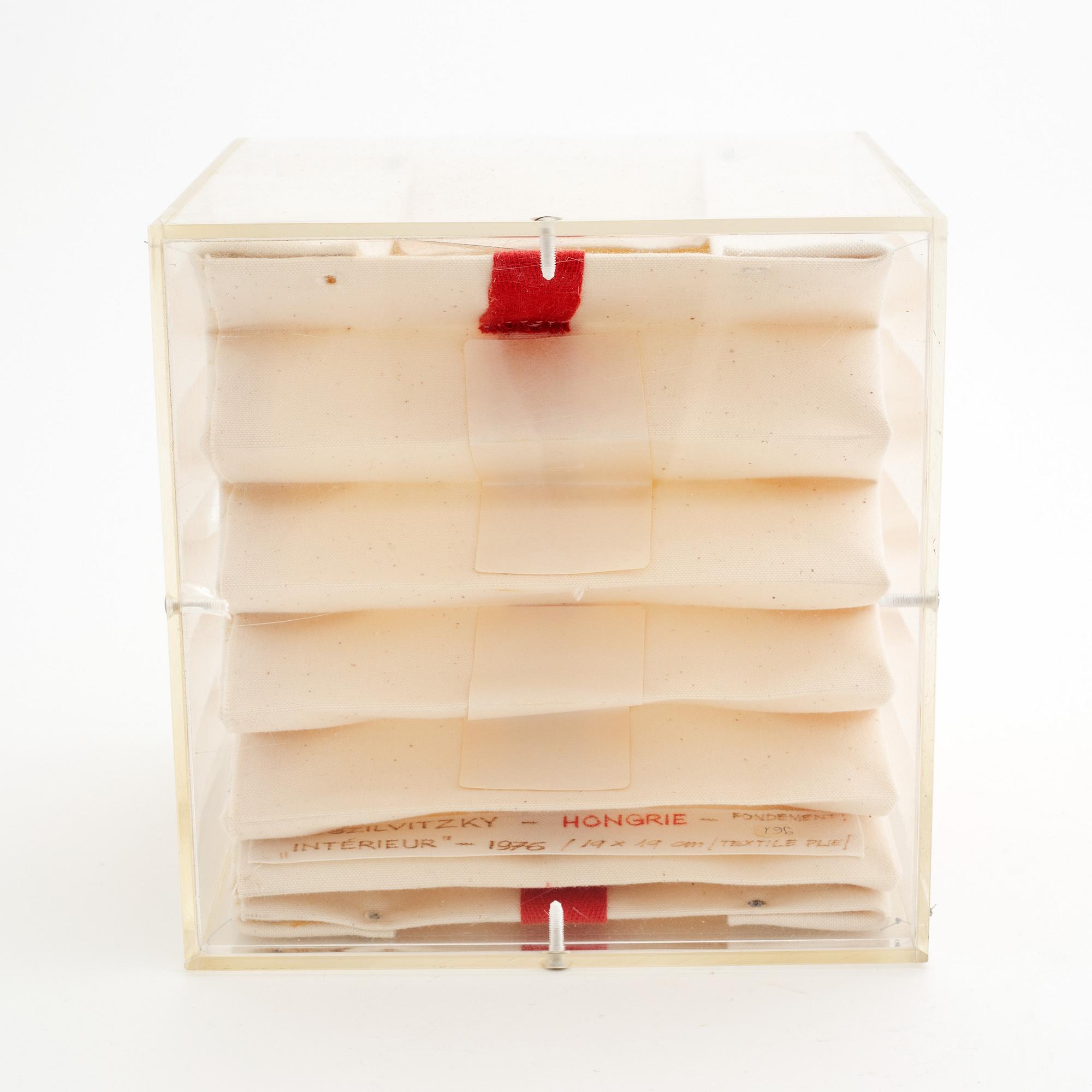 Margit Szilvitzky, a textile and plexi glass sculpture, signed and dated 1976.