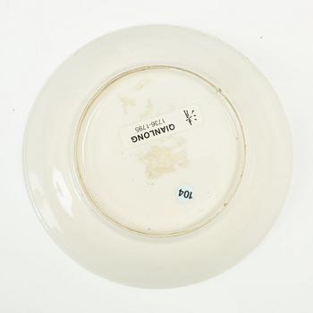 A Chinese soft paste cup with saucer, Qing dynasty, 18th century.