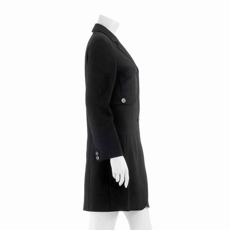 MOSCHINO, a black blendmaterial coat from the 1990s. Italian size 42.