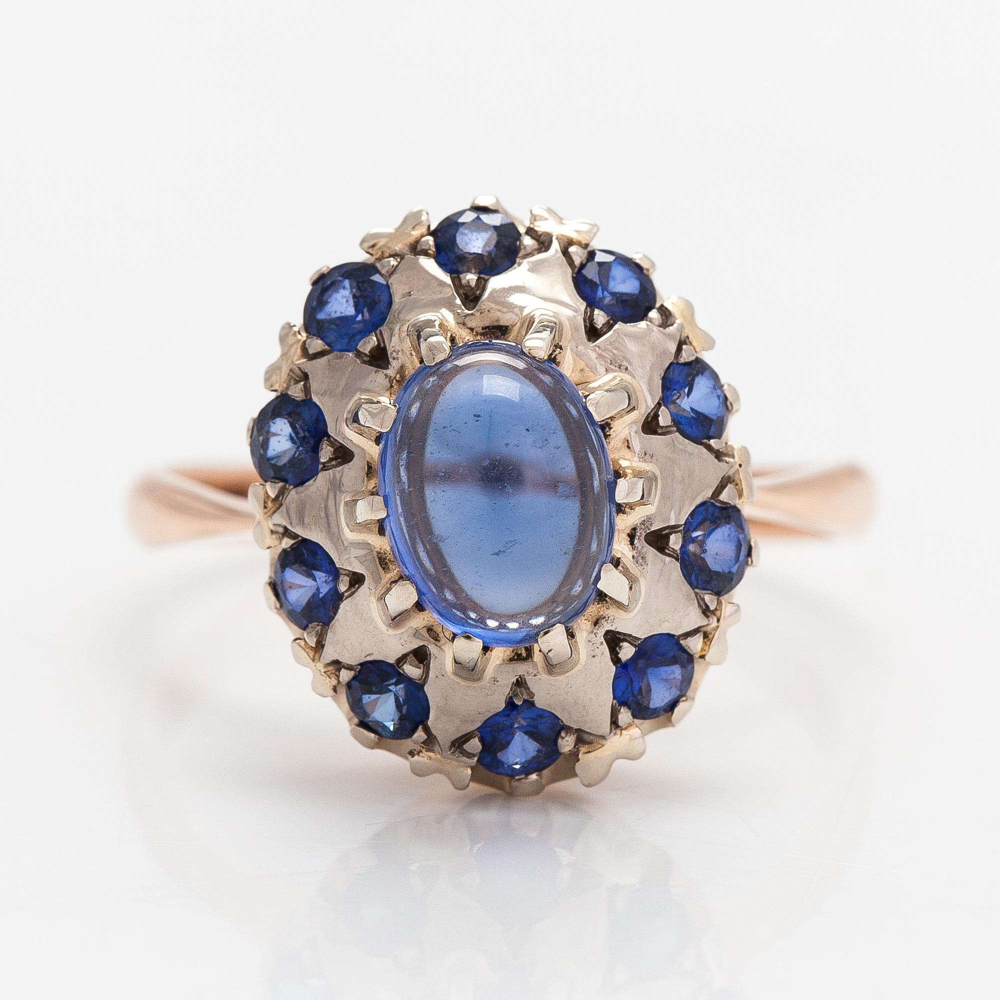 A 14K gold ring with a cabochon-cut synthetic sapphire and real sapphires. Yerevan.