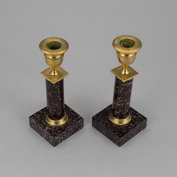A pair of late gustavian porphyry candle sticks early 19th century.
