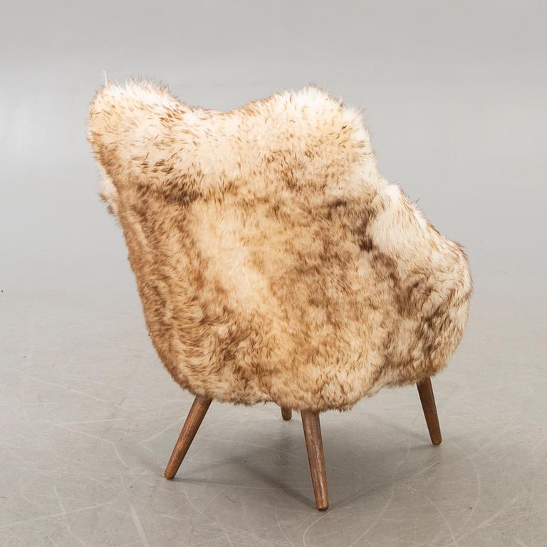 A 1950/60 sheepskin armchair.
