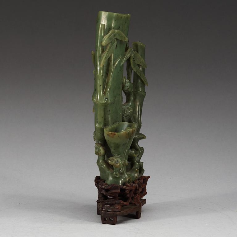 A  carved green stone sculpture, late Qing dynasty.