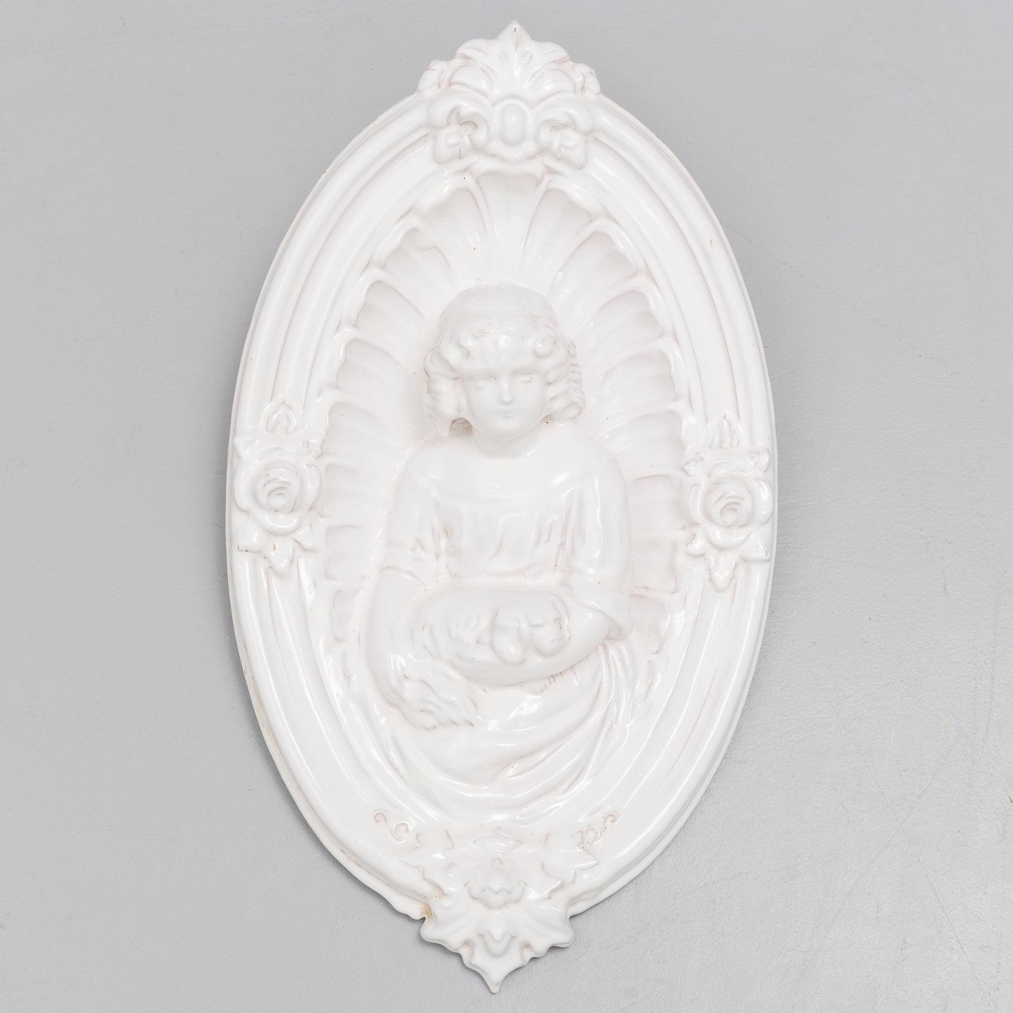 A ceramic wall relief, circa 1900.