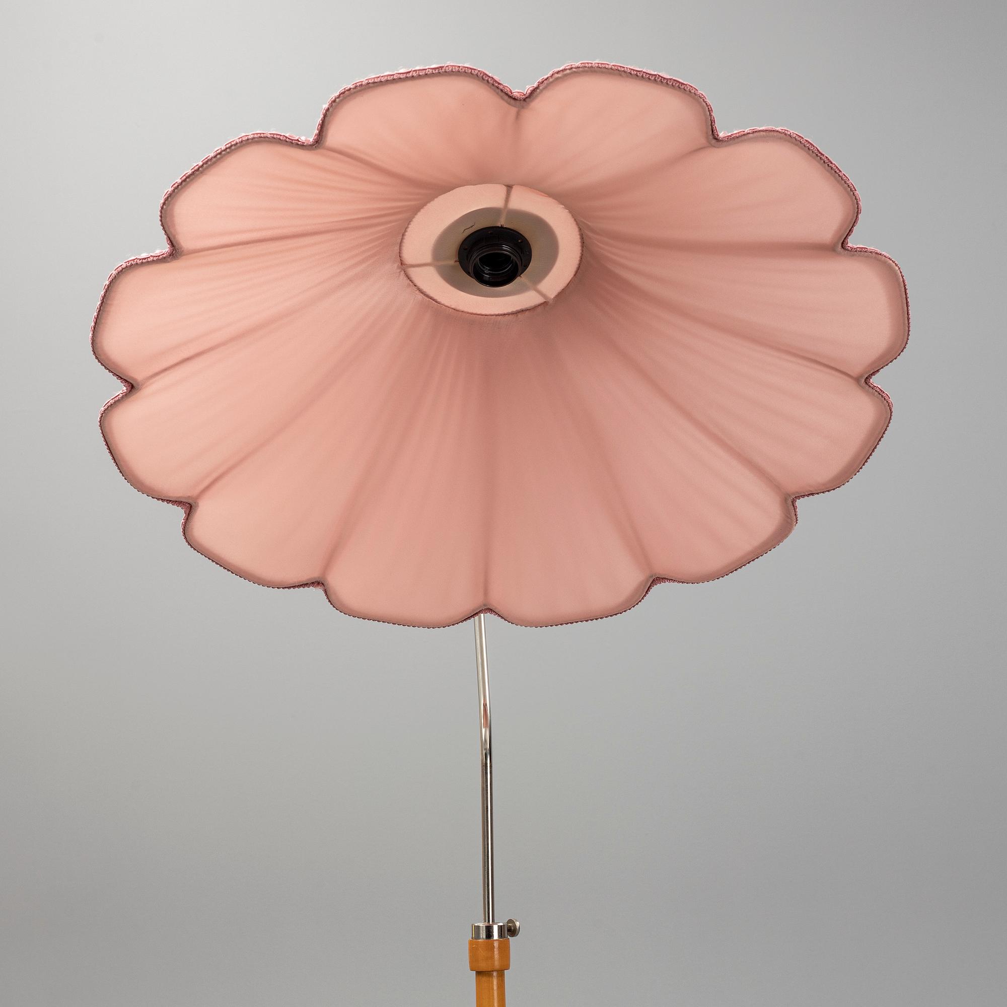 A 1940s birch wood floor lamp.