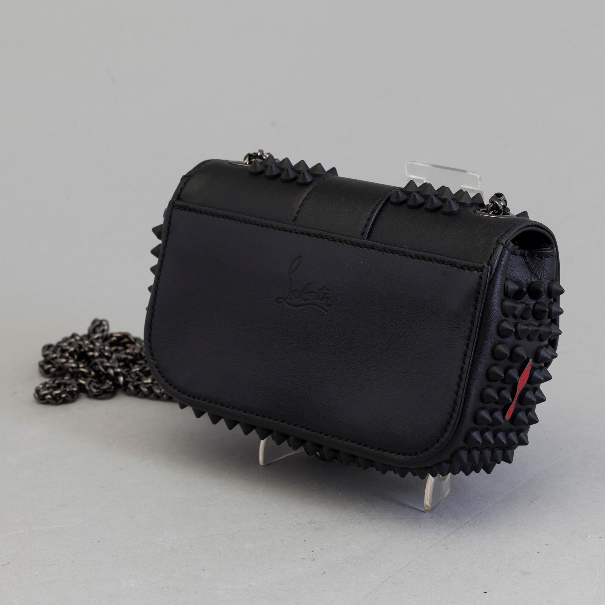 An eveningbag with studs by Christian Louboutin.