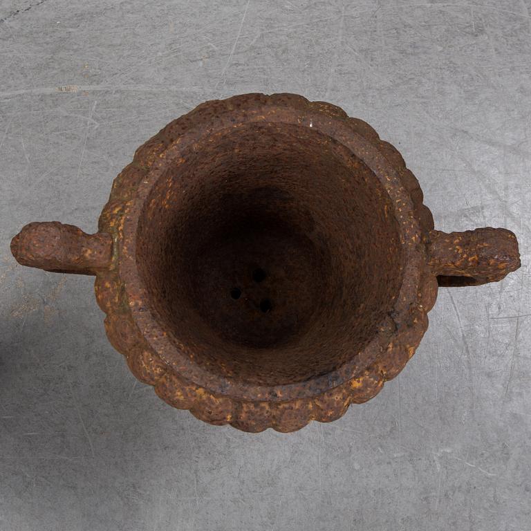 Two 19th century cast iron urns.