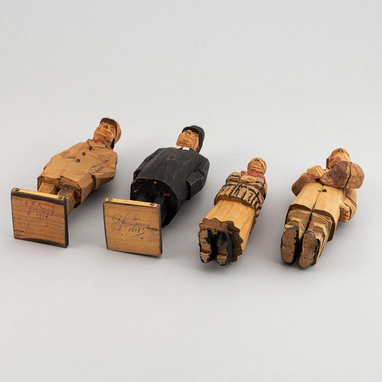 Four Carl Johan Trygg wooden sculptures, two signed and dated 1918.