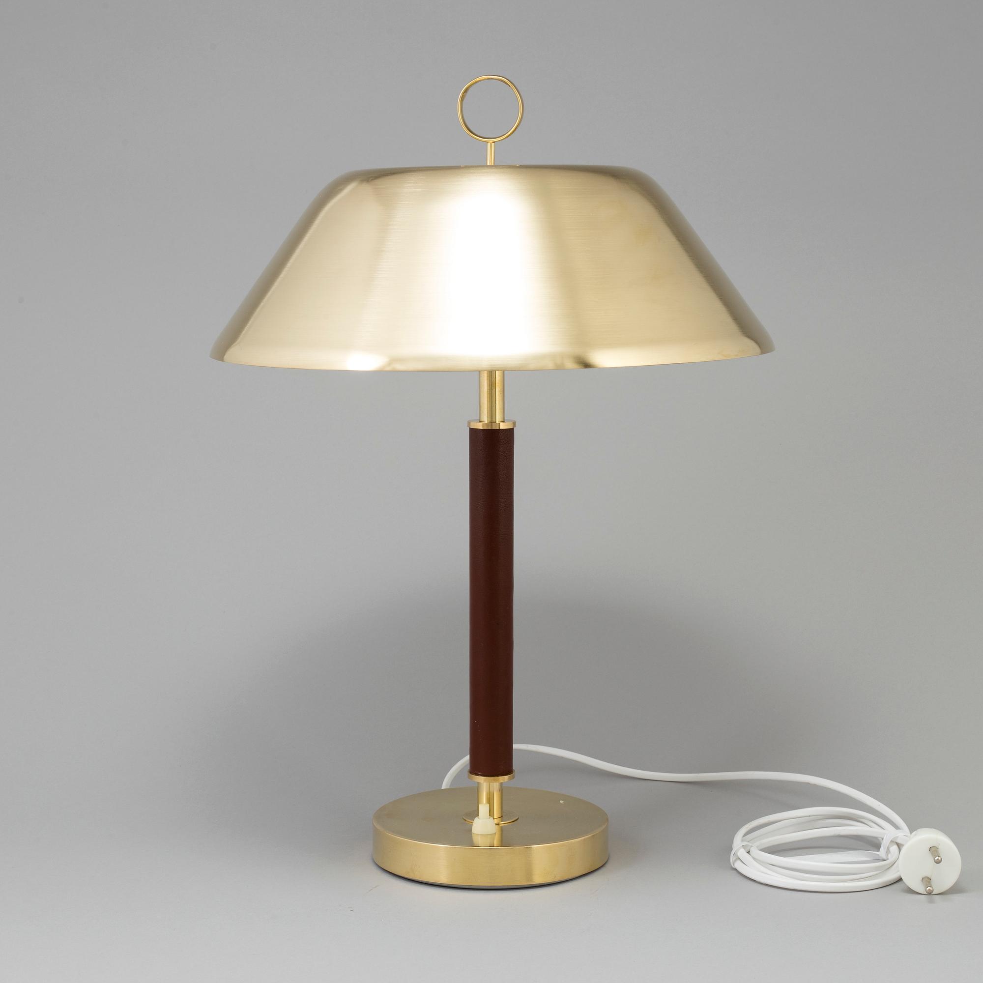 A brass and leather table light from Falkenbergs Belysning, second half of the 20th Century.