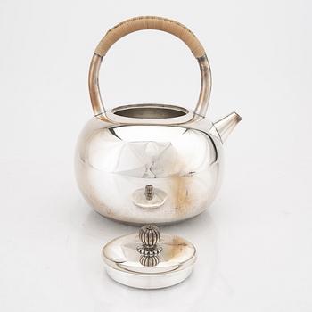 A Japanese early 20th century sterling silver tea pot.