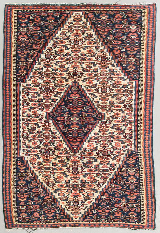 A semiantique Senneh carpet ca 168 x 113 cm.