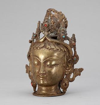 375. BUDDAHUVUD, brons med stenar. Troligen Nepal.