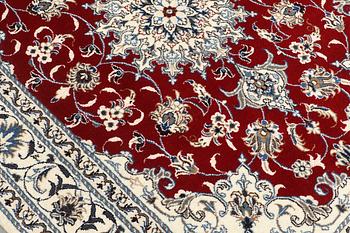A rug, Nain part silk, ca 208 x 149 cm.