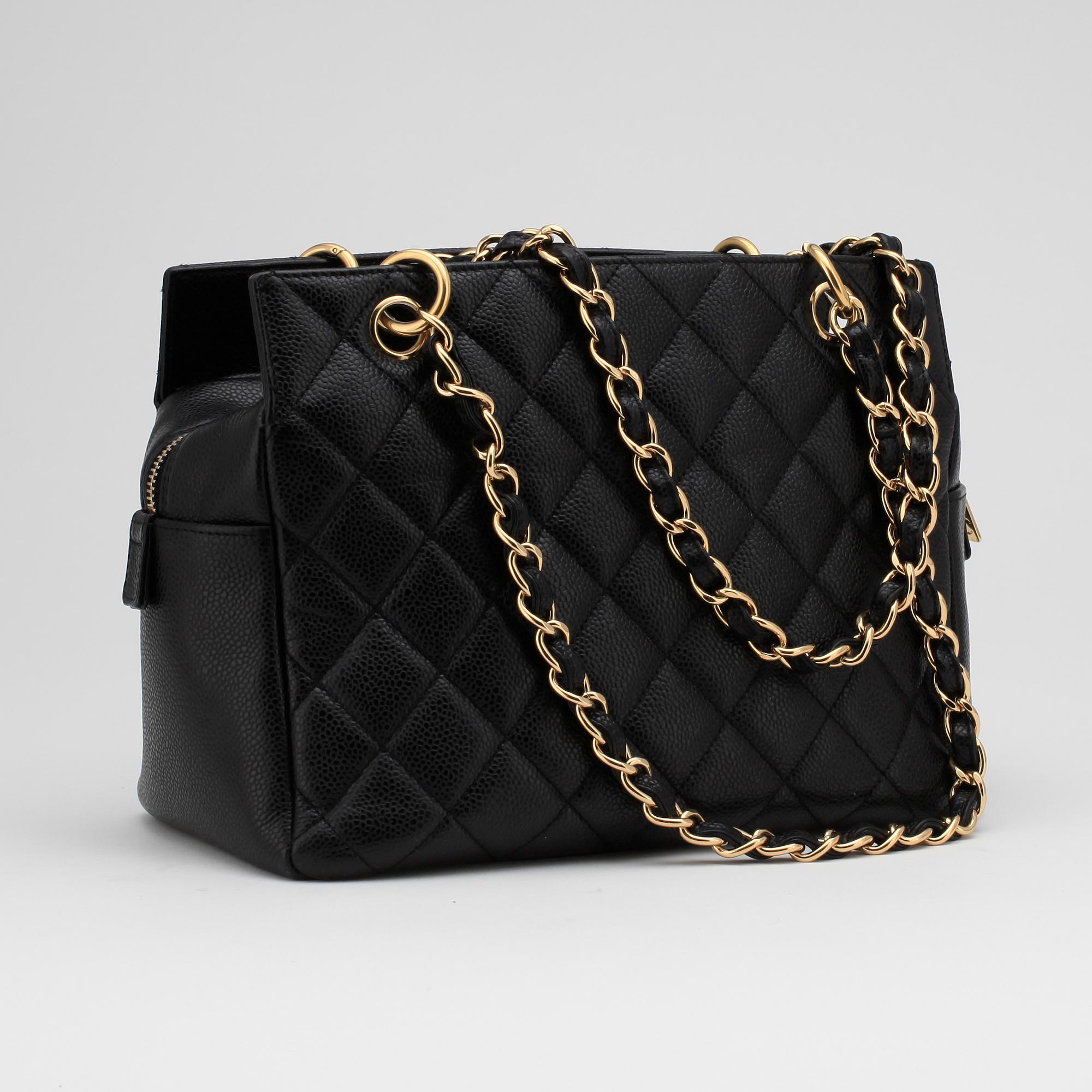 CHANEL, a black leather "Medium Shopping" handbag.
