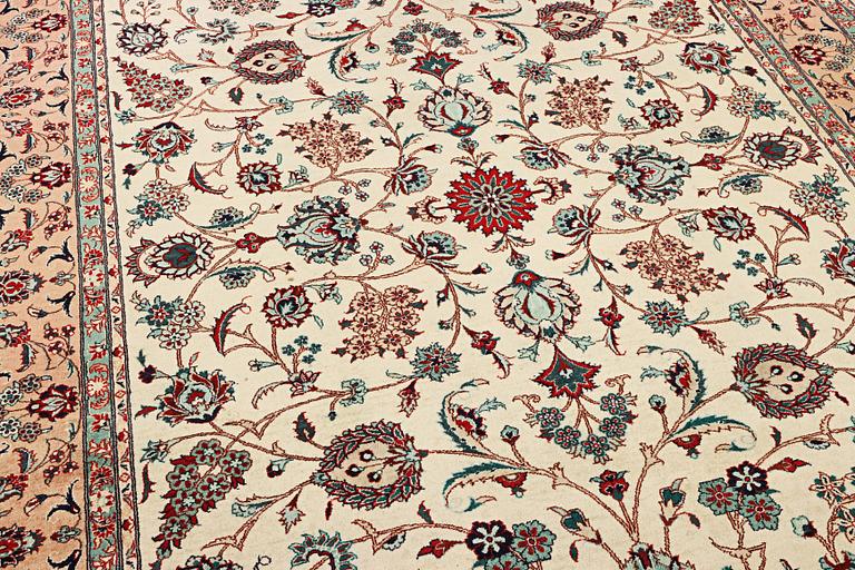 An oriental silk carpet, a. 280 x 185 cm.