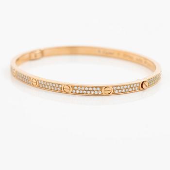 A Cartier bangle "Love" 18K rose gold with round brilliant-cut diamonds.