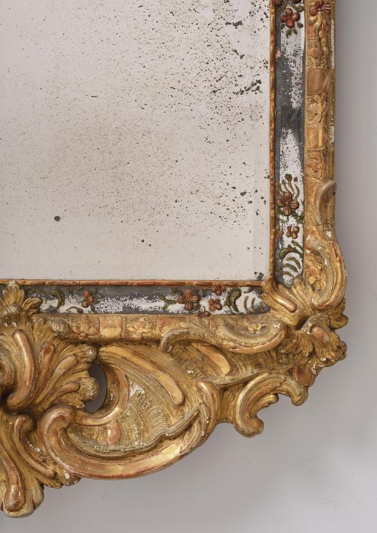 A Swedish giltwood and polychrome-painted Rococo mirror, later part of the 18th century.