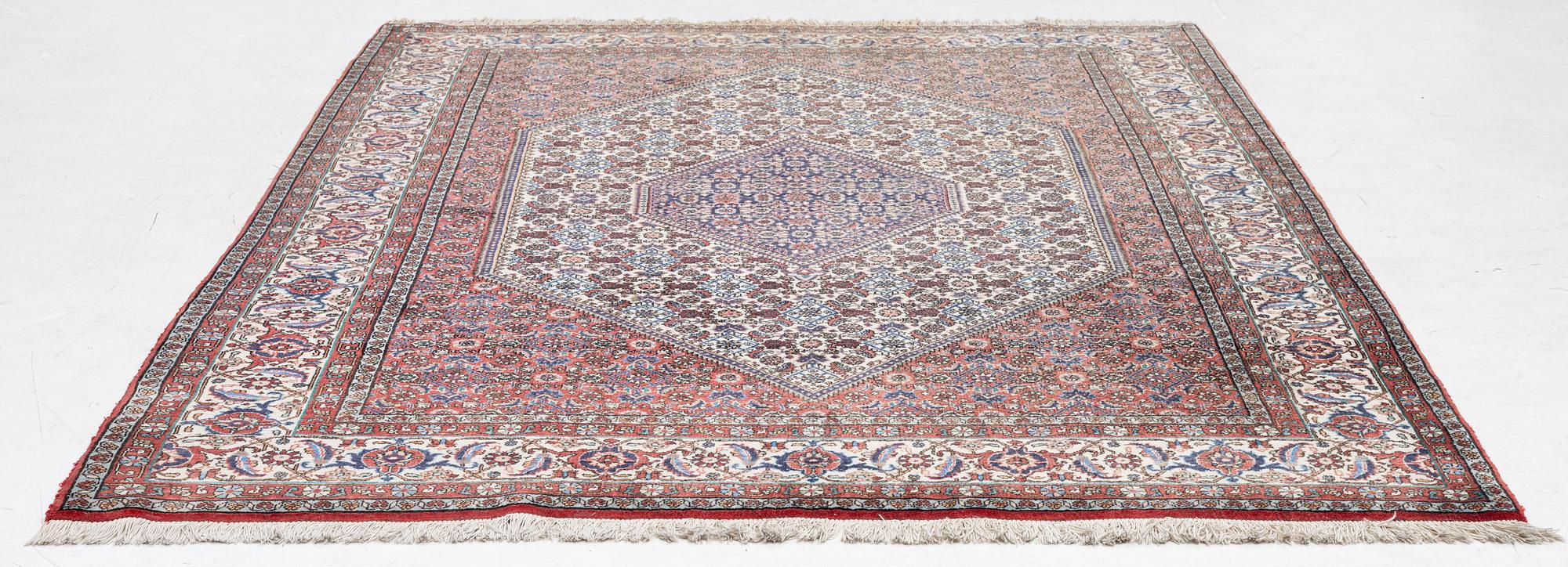 An oriental rug, approx. 238 x 174 cm.