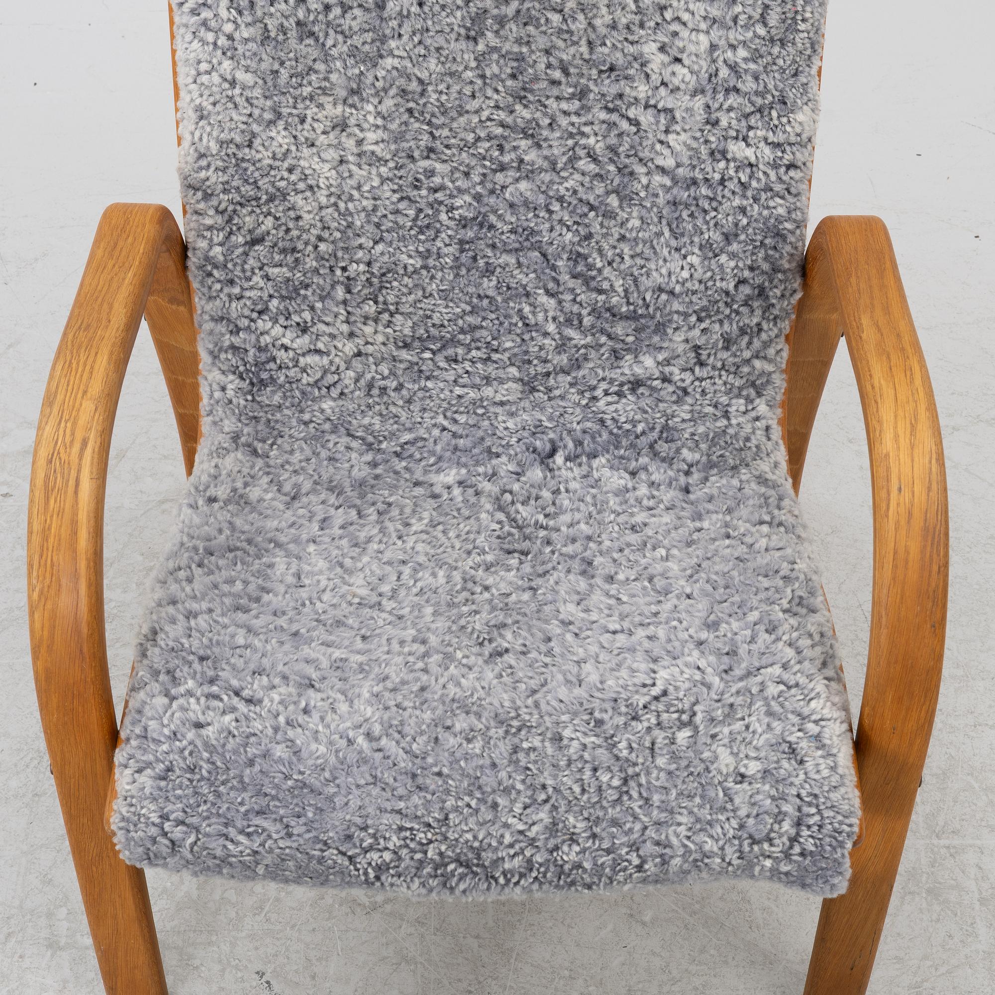 Jan Ekström, armchair with footstool "Gazelle", Conform, 21st century.