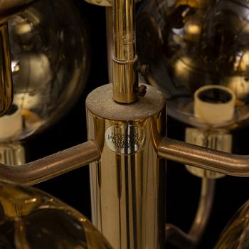 Hans-Agne Jakobsson, a late 20th century brass and glass ceiling lamp for nine lights, Markaryd, Sweden.