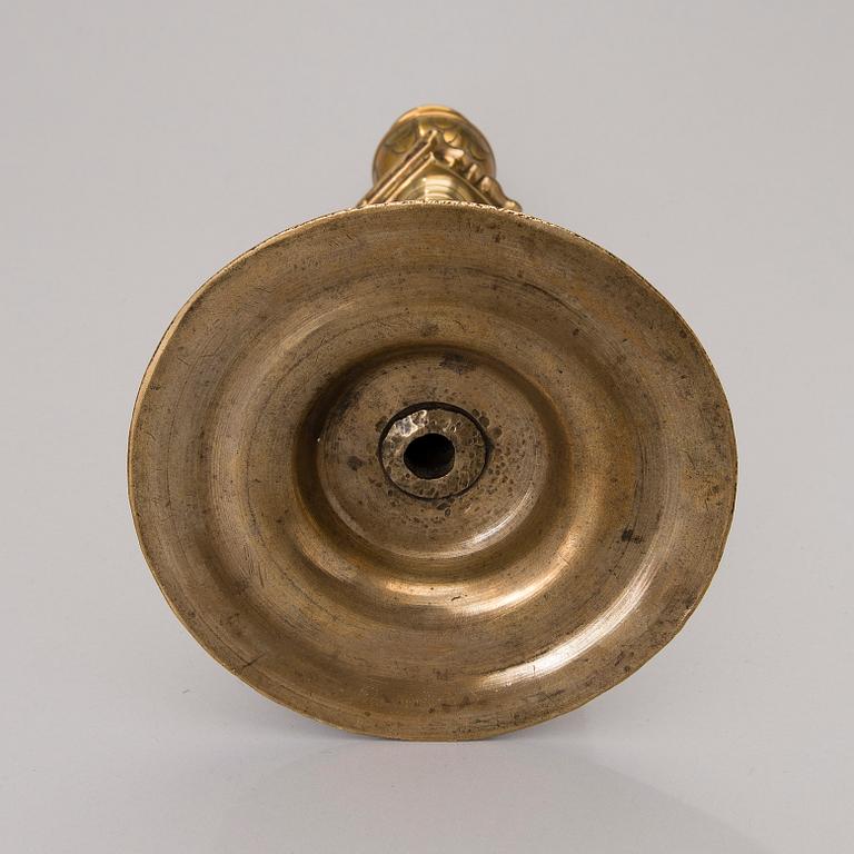 A brass candlestick from Flanders / Germany of the turn of the 17th century.