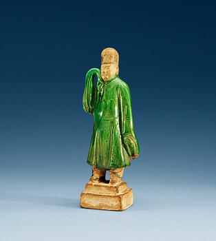 1261. A green glazed figure of a man, Ming dynasty.